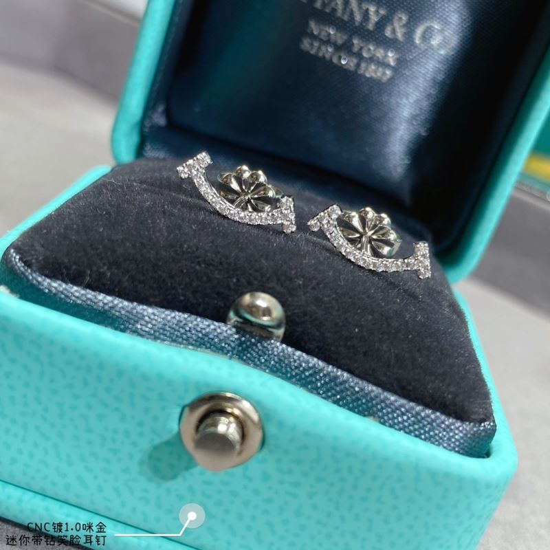 T*f*ny earrings